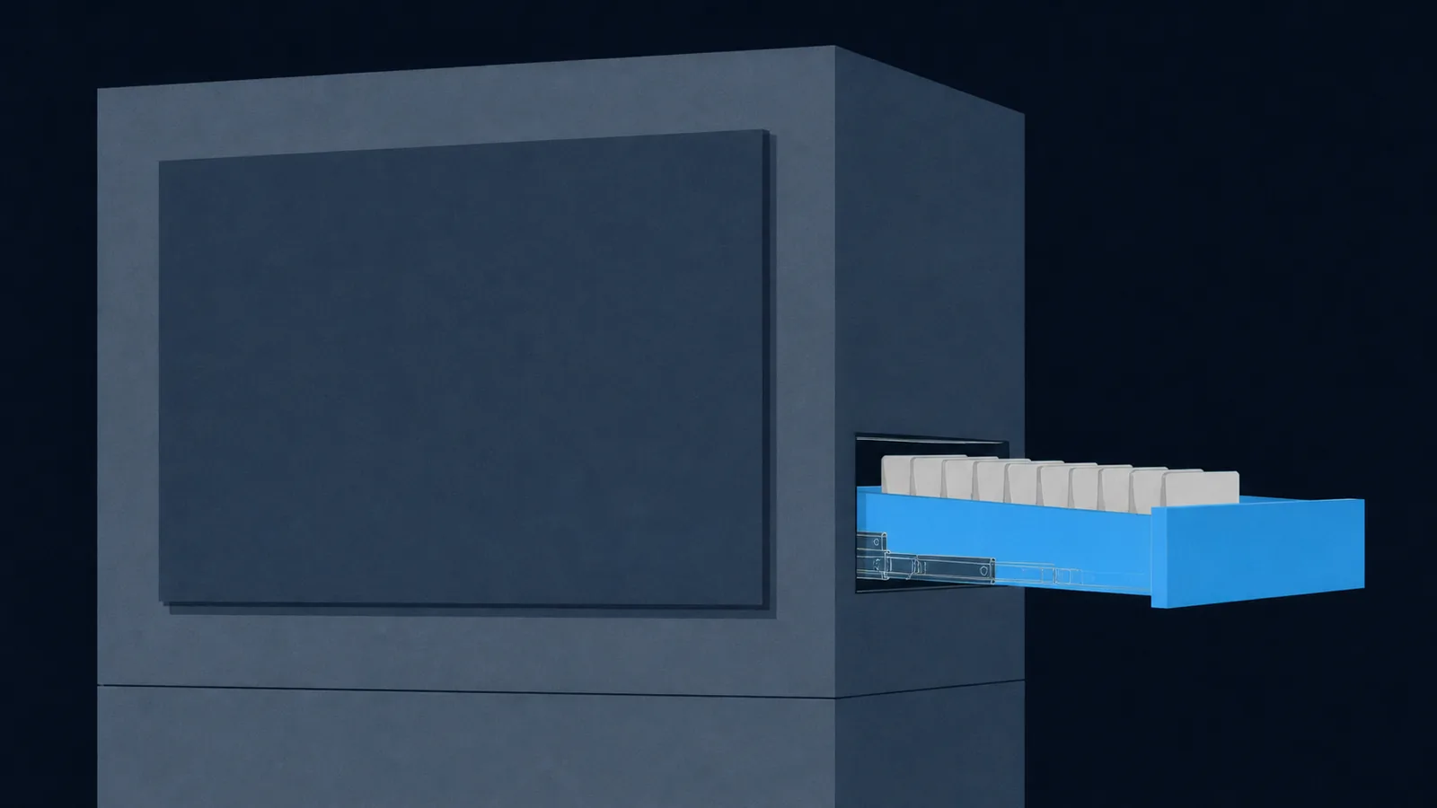An enormous solid slab with one shallow drawer pulled out, holding a row of small blank tabs.